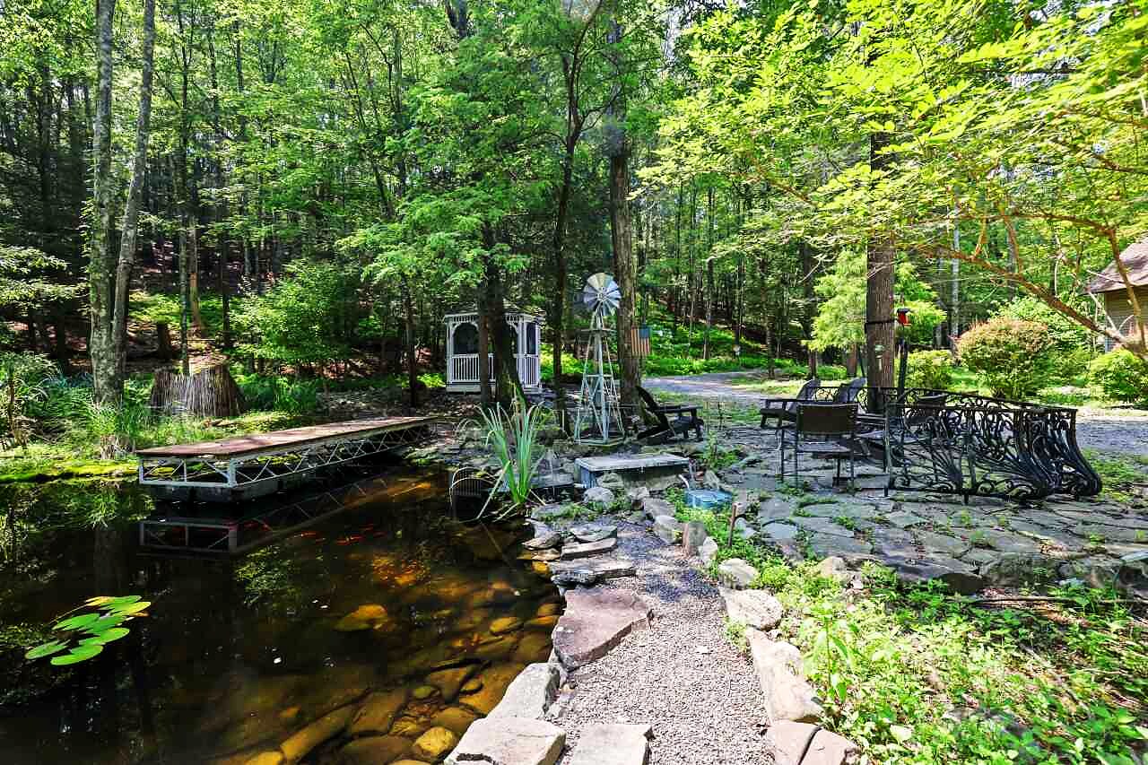 The stocked koi pond with a gazebo and a working windmill.